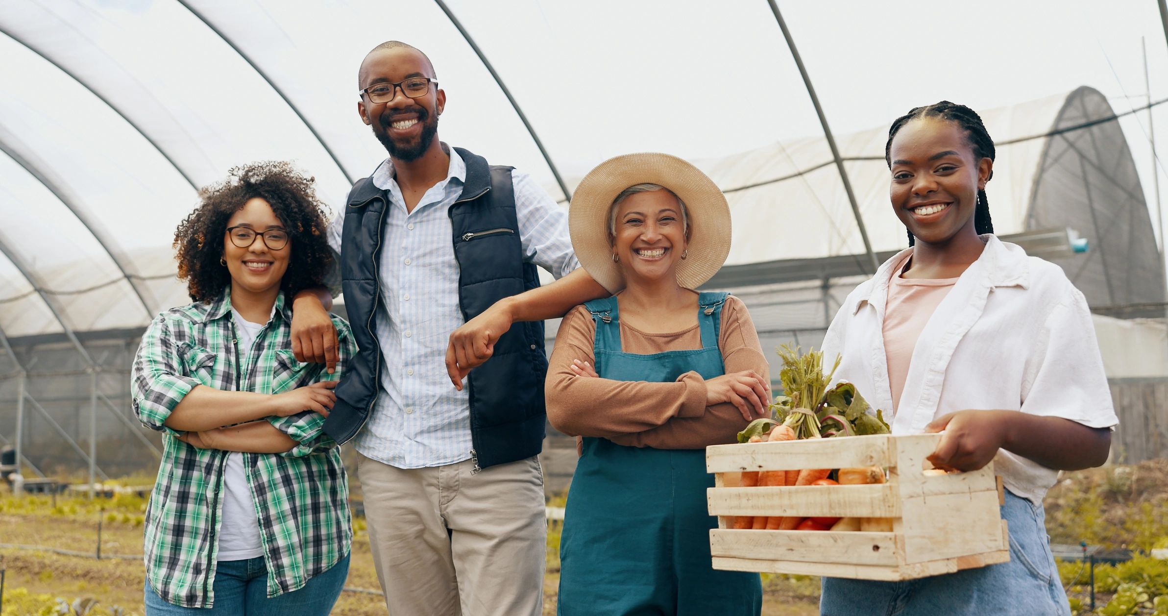 Team members teaching farming techniques to participants